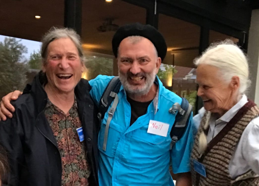 Neil, arm in arm with permaculture co-originator David Holmgren, both laughing, at the RetroSuburbia book launch